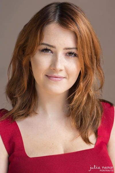 Melbourne natural light actor headshot of redhead woman in a red top.