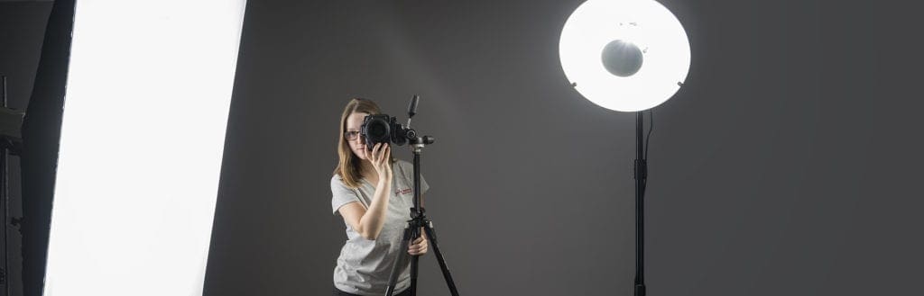 Julia Nance, headshot photographer, taking photographs in studio.