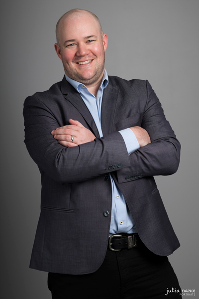 Corporate personal branding portrait of smiling man in melbourne studio with arms crossed
