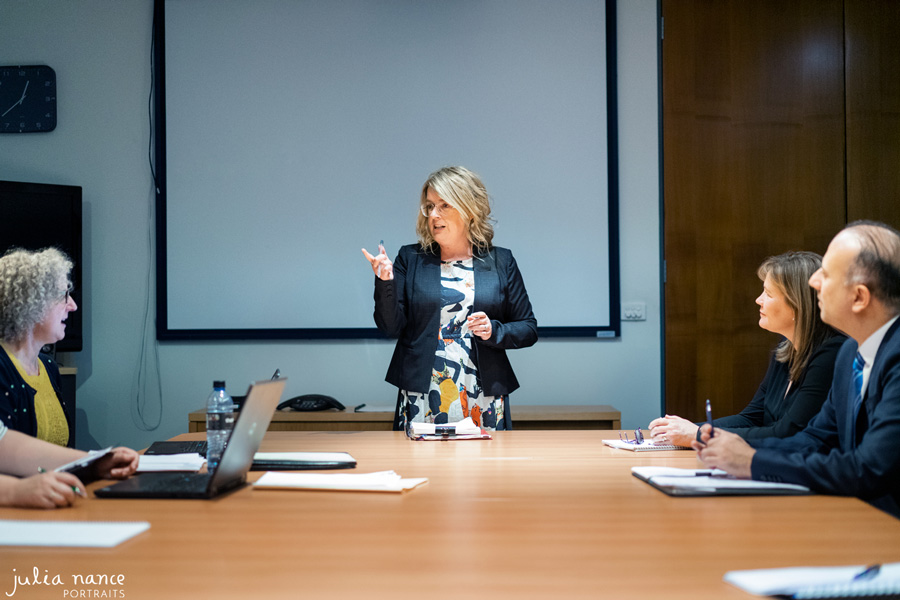 Melbourne branding photography on site of woman in board room meeting