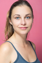 Girl with blue eyes on pink background for acting headshots
