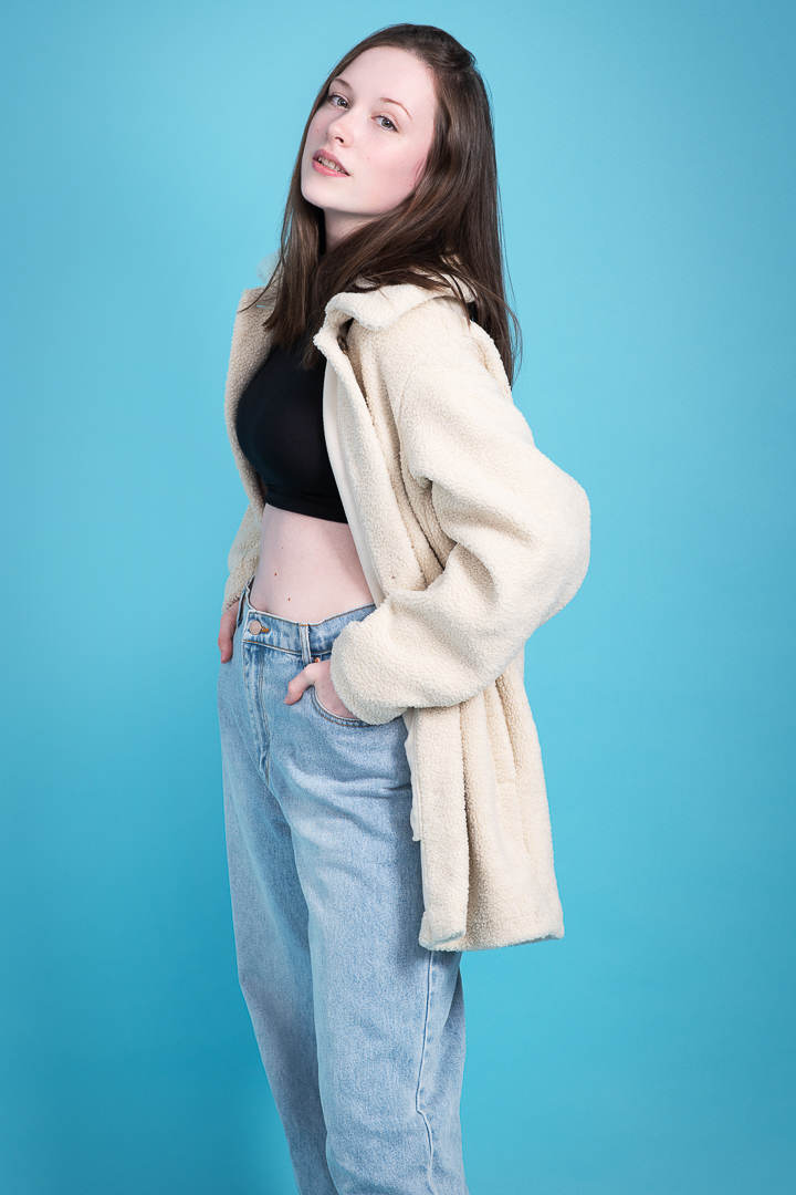 Teen model portfolio update of girl on a blue background