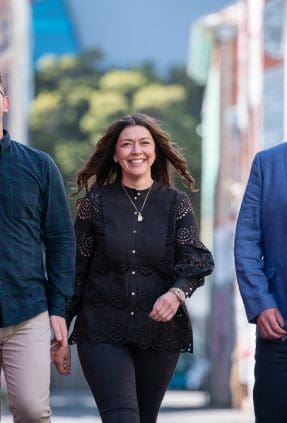 team of staff outside in Melbourne alleyway for staff headshot