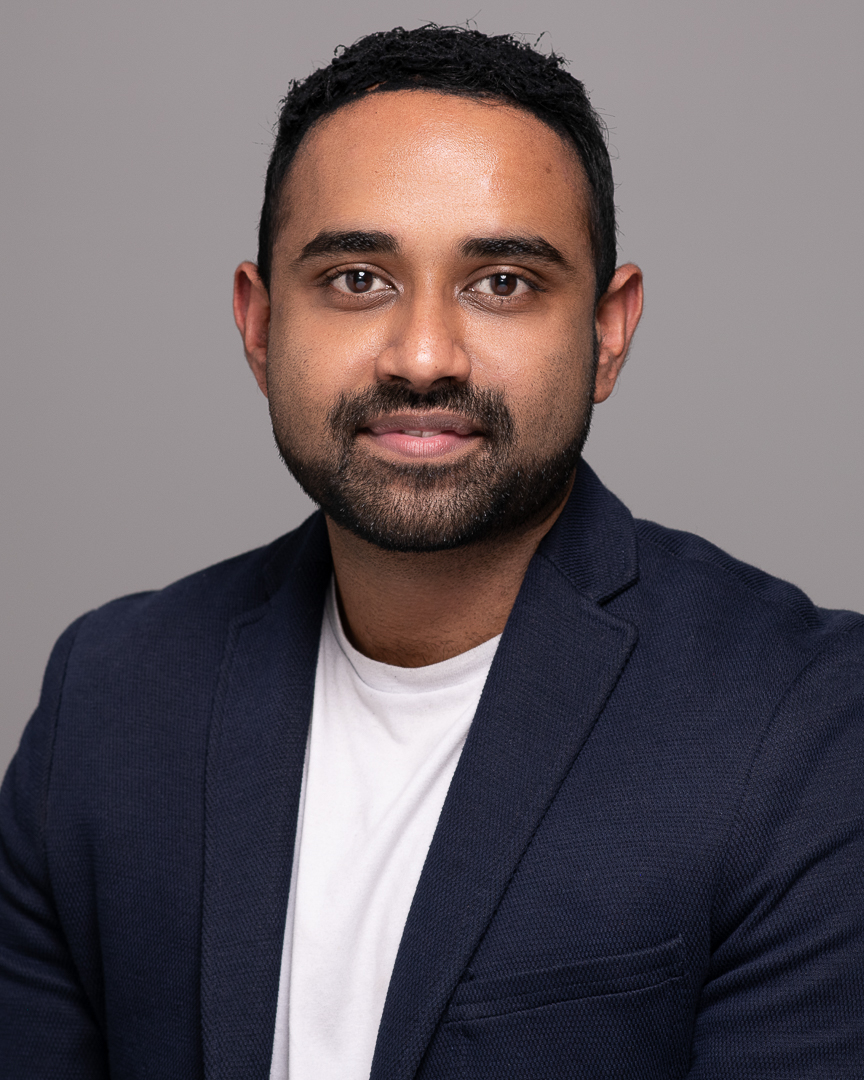 Corporate headshot of melbourne man taken on a grey background.