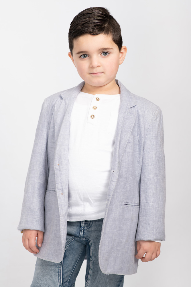 Young Melbourne boy poses with a serious expression for a model portfolio update, taken in studio.