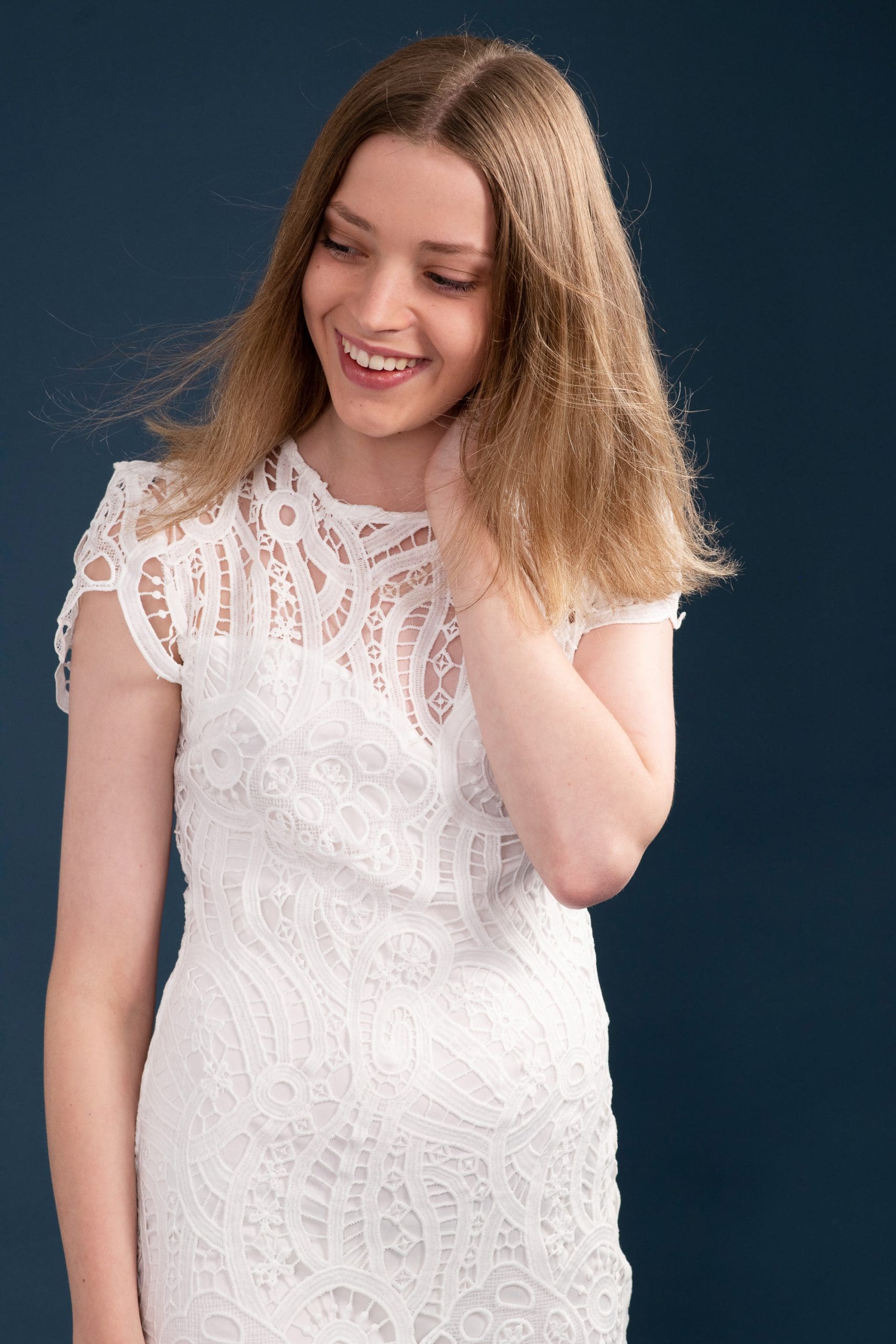 Melbourne teen model in a portfolio update, showing a candid smile looking away from camera.