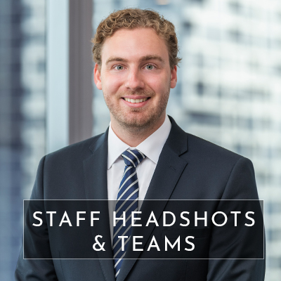 A professional corporate staff headshot taken with melbourne city skyline as the background. Text overlays the image saying "staff headshots & teams"