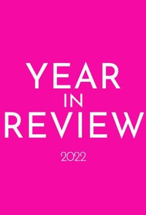 Image is bright pink with white text saying "year in review 2022"
