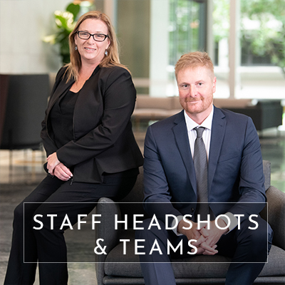 Text overlays the image saying "staff headshots & teams". Behind the text is an image of a woman and man in a corporate setting. This image is used to redirect you to a page with information for people needing staff headshot photography and corporate business photography in melbourne.